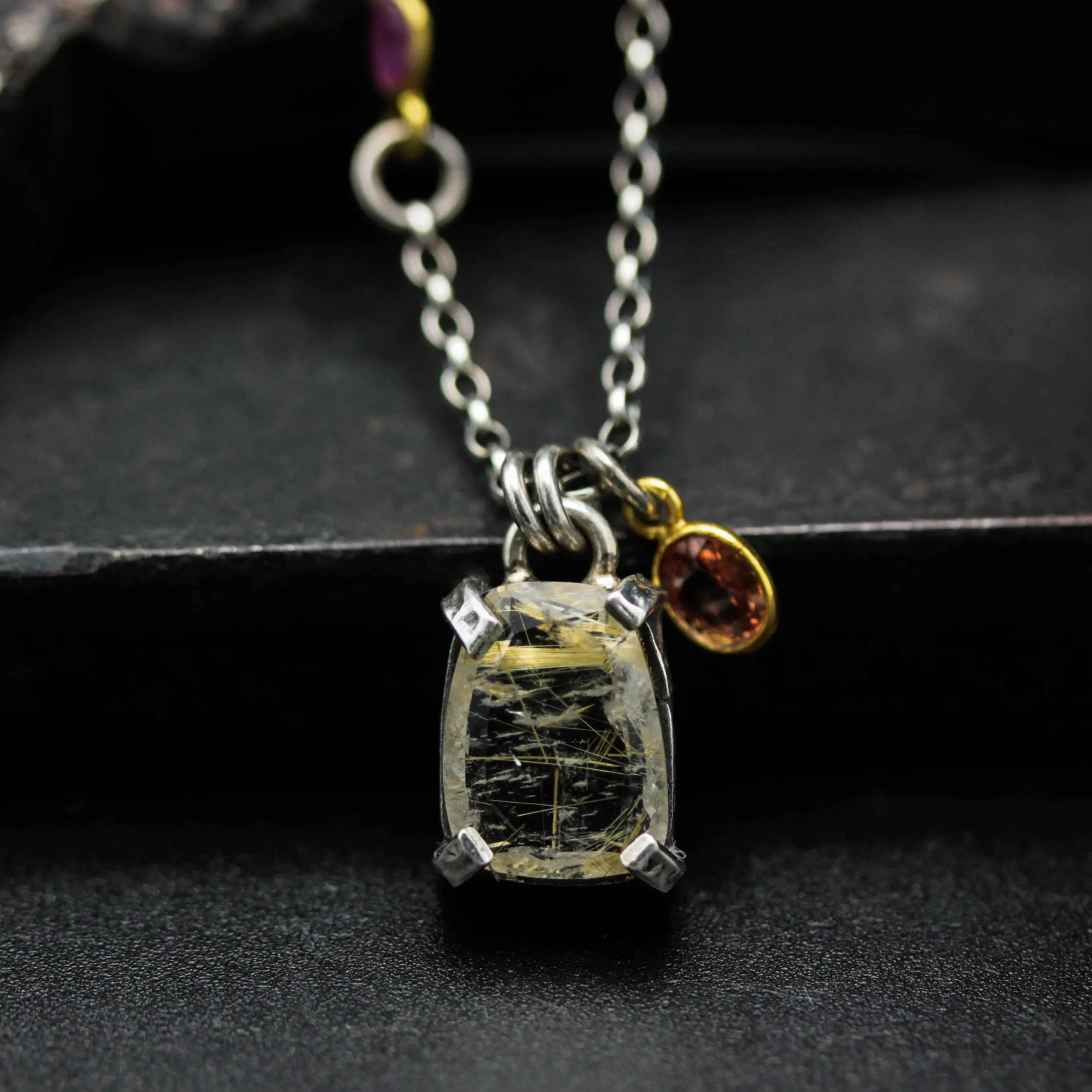 Golden rutilated quartz pendant necklace in silver bezel and prongs setting with sterling silver chain