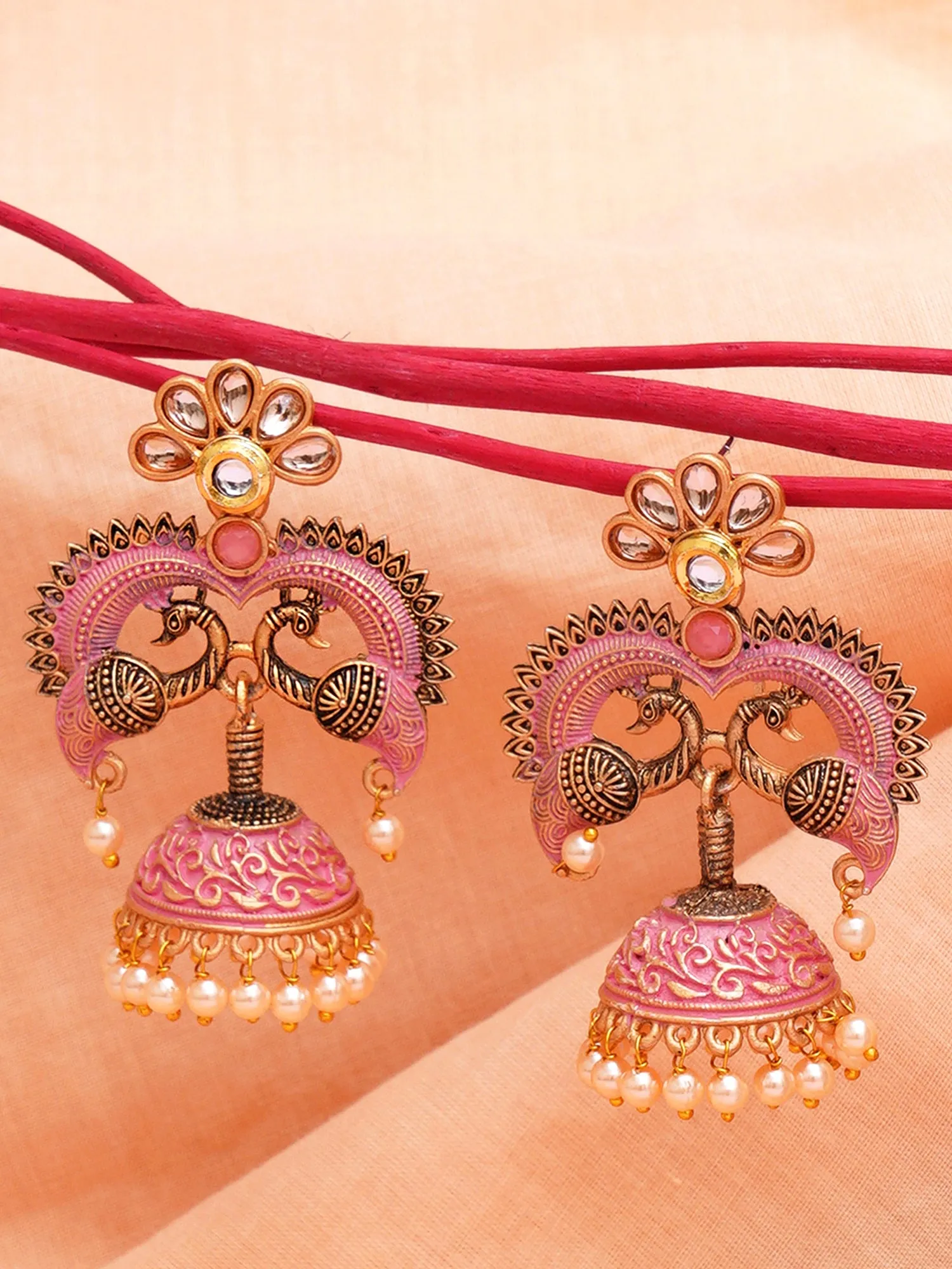 Karatcart Antique Gold Plated Pink Designer Peacock Jhumki Earrings for Women