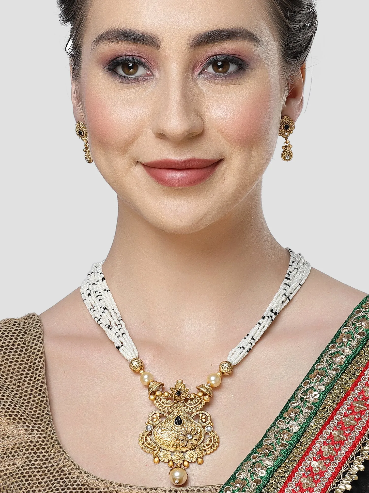 Karatcart Gold Plated Black Stone Studded Beaded Ranihaar Necklace Set for Women