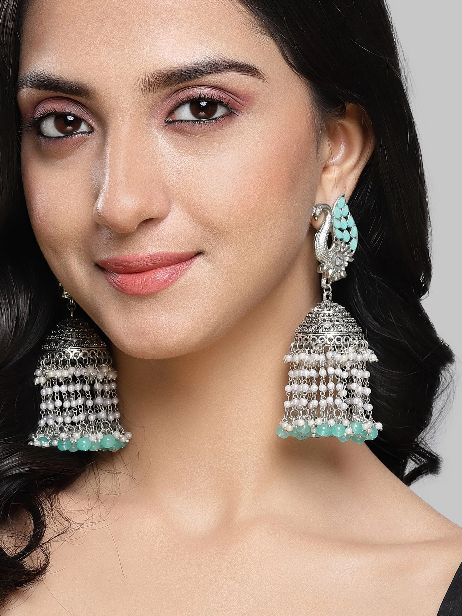 Karatcart Oxidised Silver Light Blue Kundan Peacock Jhumki Earrings for Women