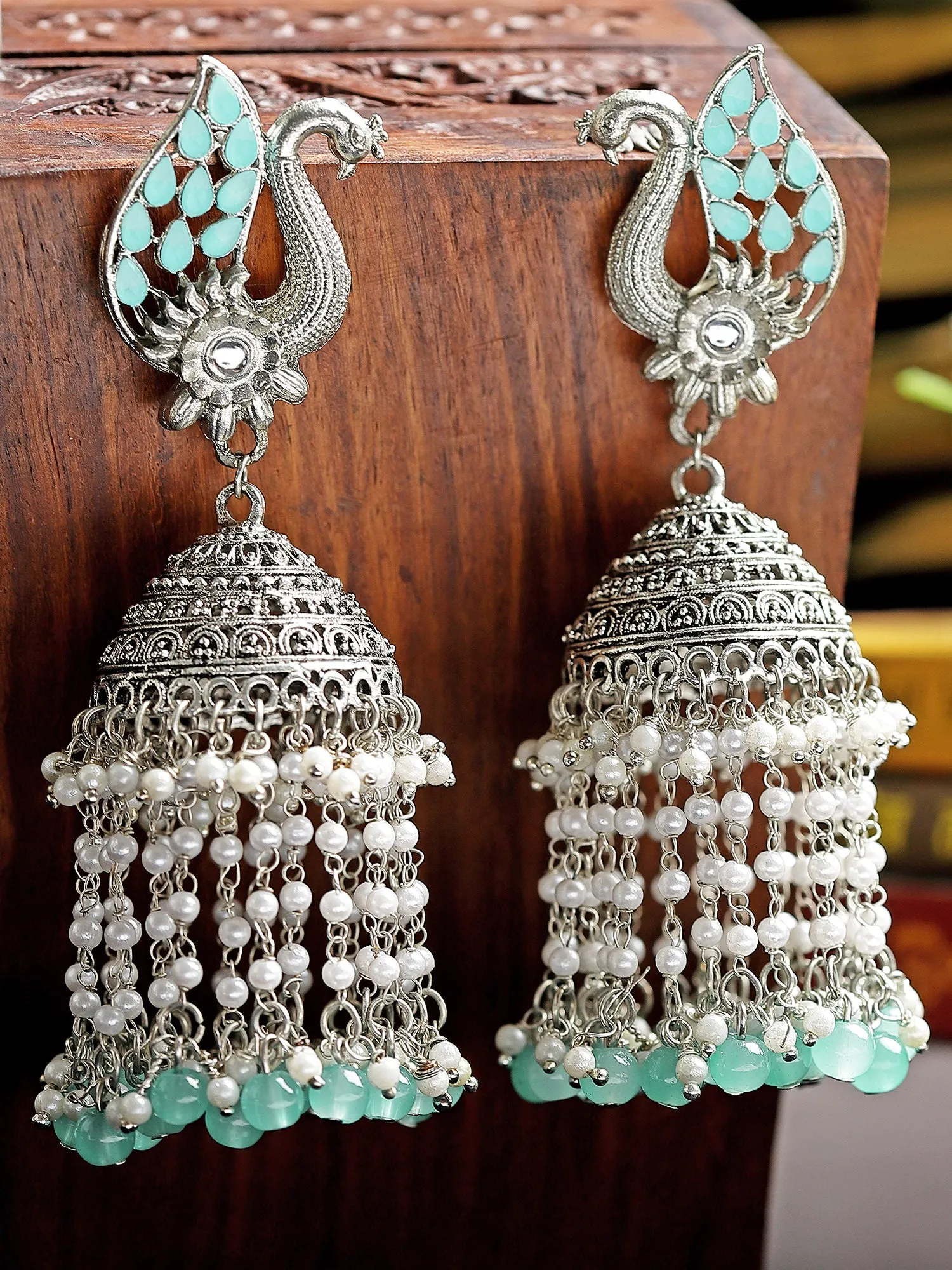 Karatcart Oxidised Silver Light Blue Kundan Peacock Jhumki Earrings for Women