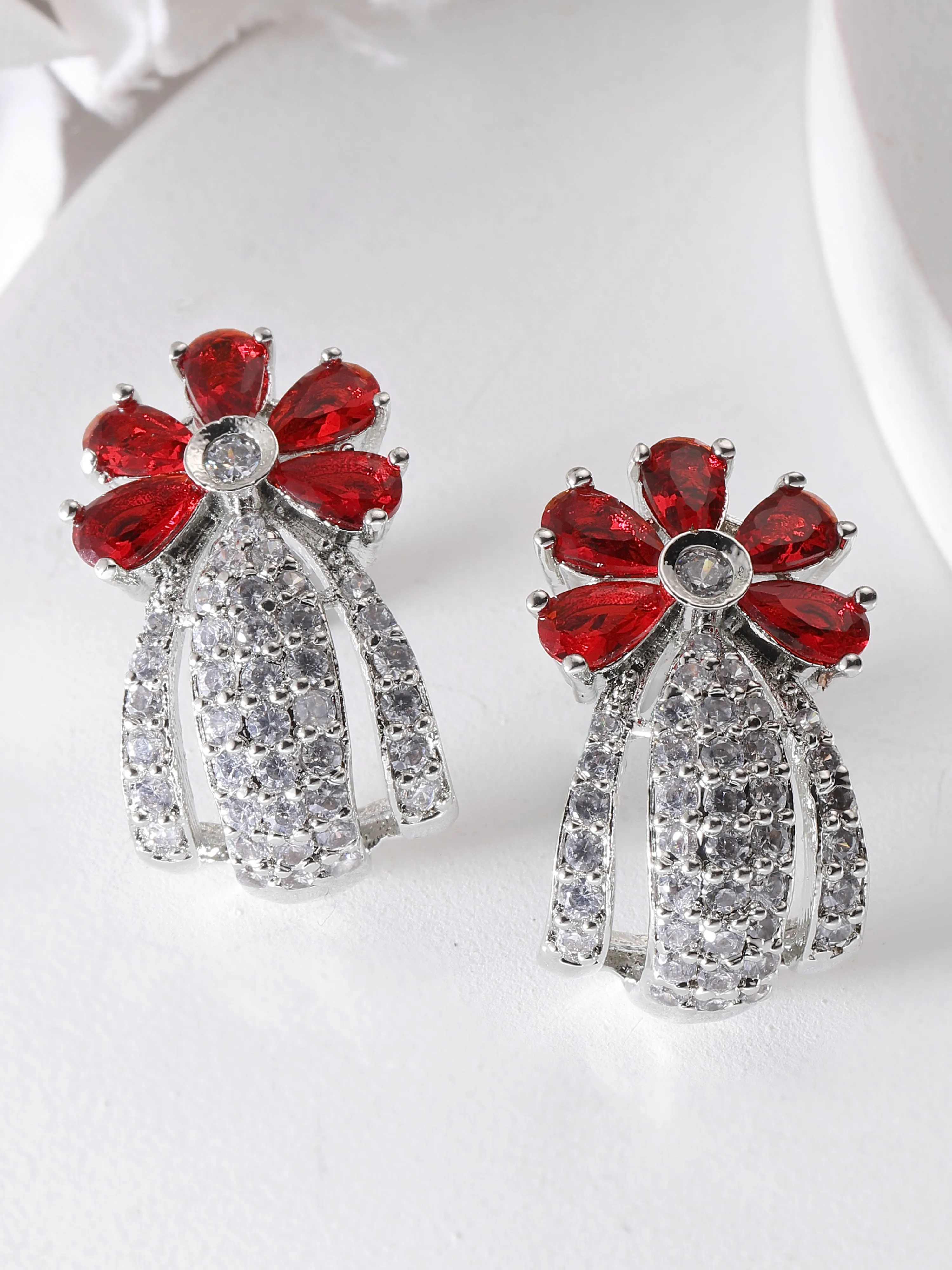 Karatcart Silver Plated Red Stones Floral Design AD Stud Earrings for Women