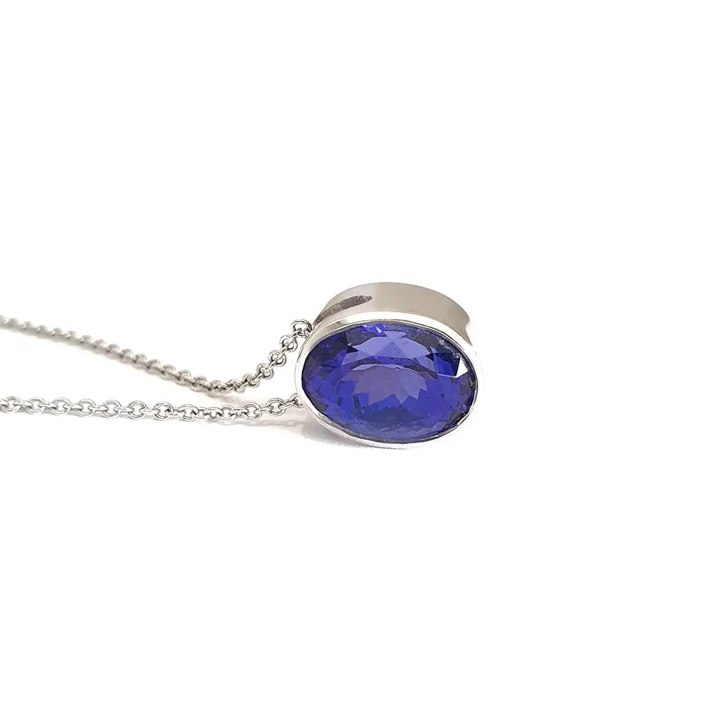 Luxuriously Suspended Slim Bezel Oval Tanzanite Pendant