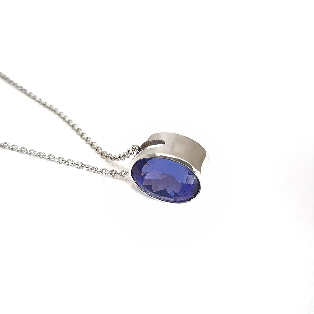 Luxuriously Suspended Slim Bezel Oval Tanzanite Pendant