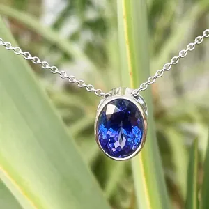 Luxuriously Suspended Slim Bezel Oval Tanzanite Pendant