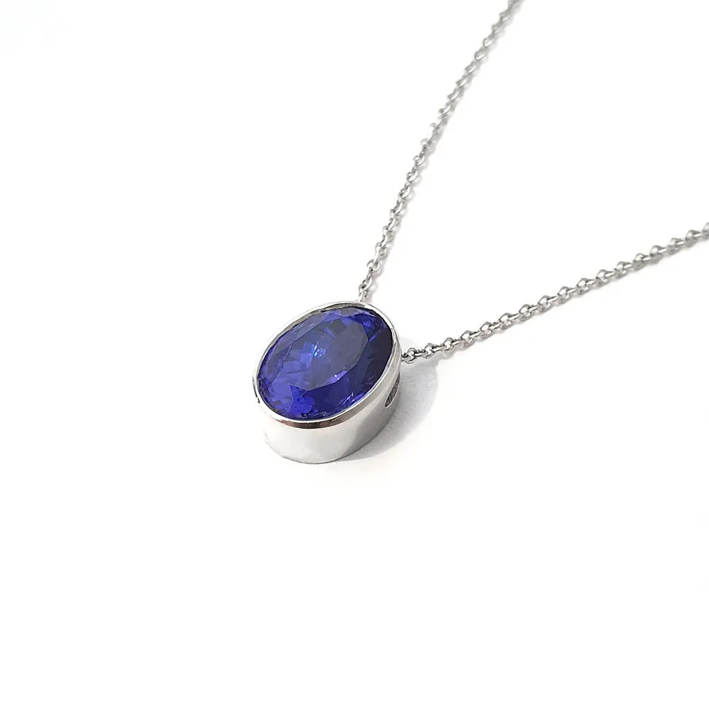 Luxuriously Suspended Slim Bezel Oval Tanzanite Pendant