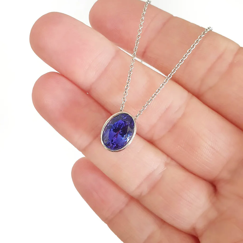 Luxuriously Suspended Slim Bezel Oval Tanzanite Pendant