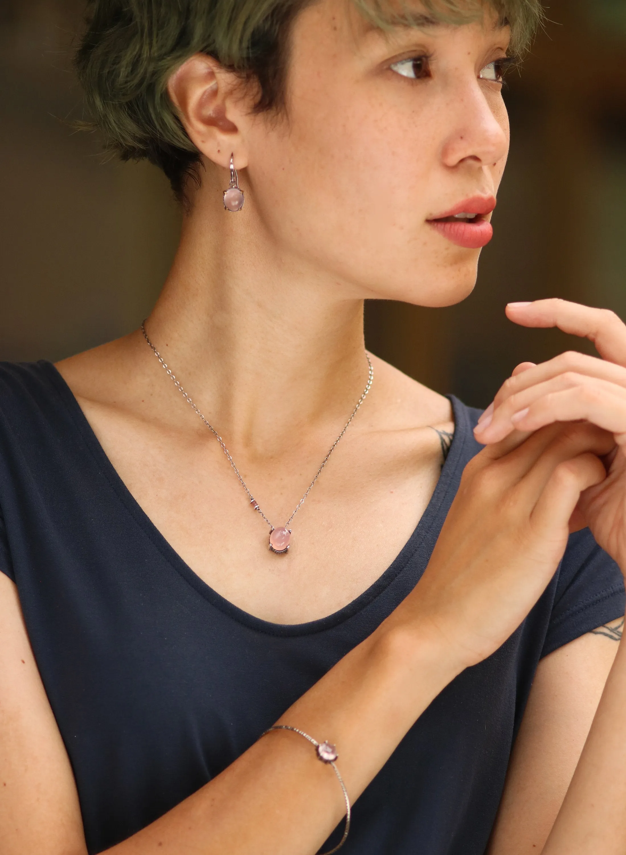 Oval cabochon Rose quartz earrings in silver bezel setting with polished brass accent prongs