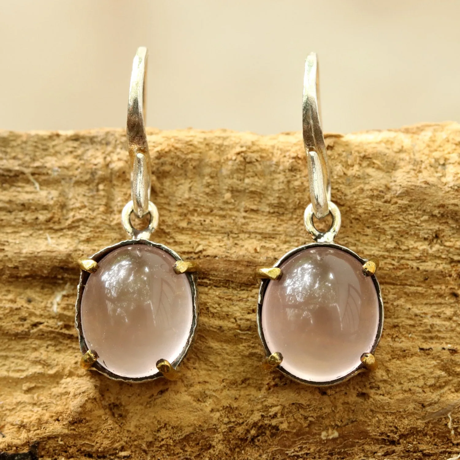 Oval cabochon Rose quartz earrings in silver bezel setting with polished brass accent prongs