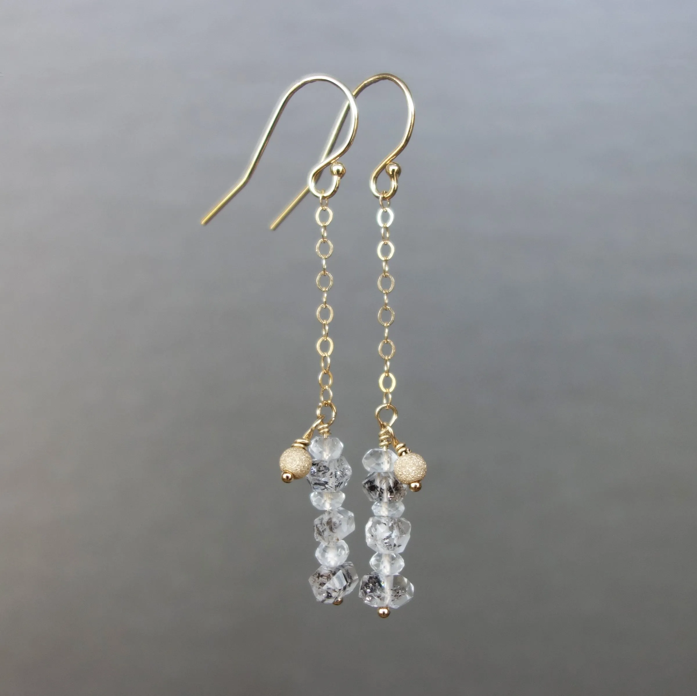Rhudalated crystal quartz on chain ear in gold or silver
